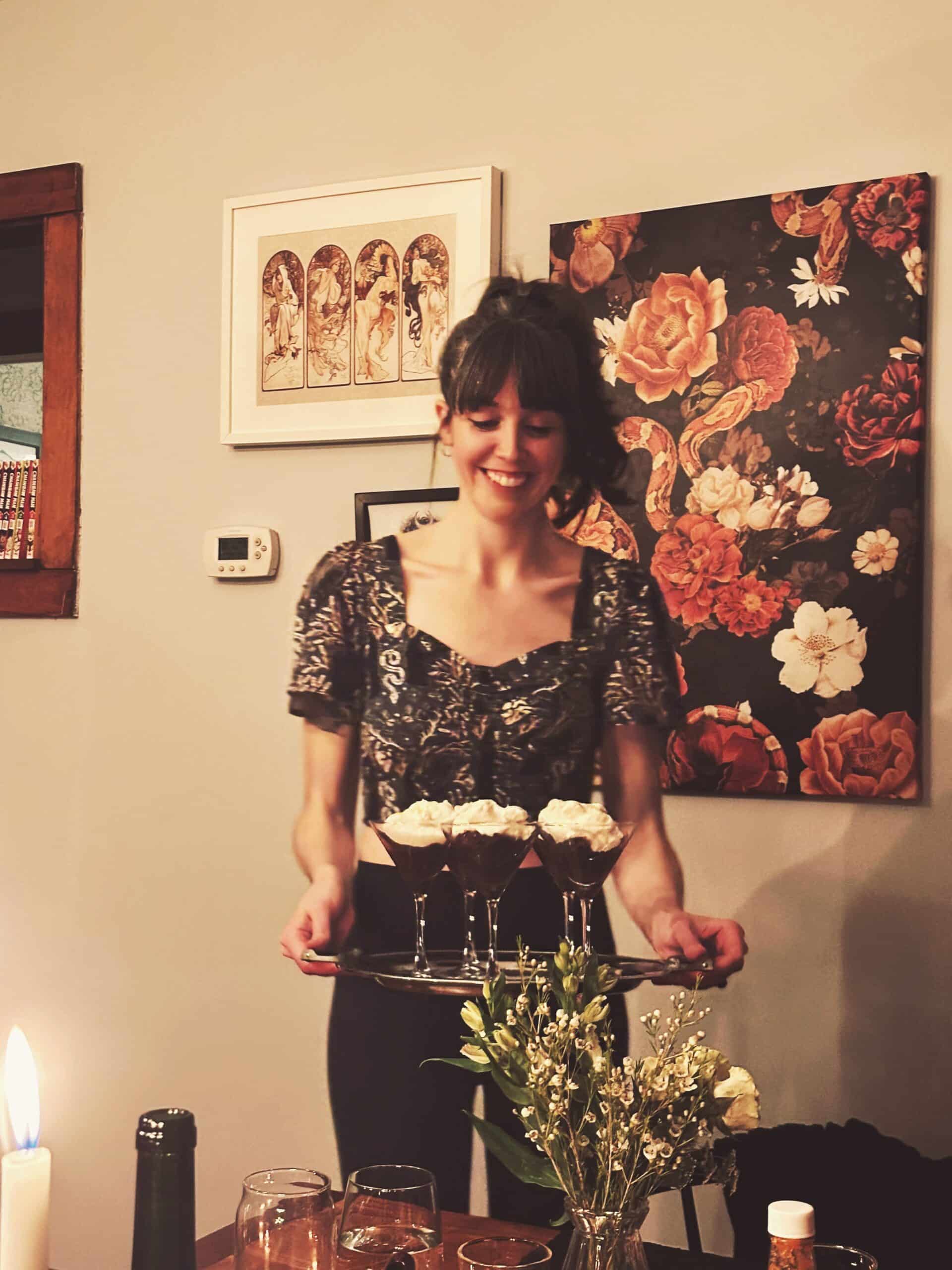 Girl holding a tray of desserts